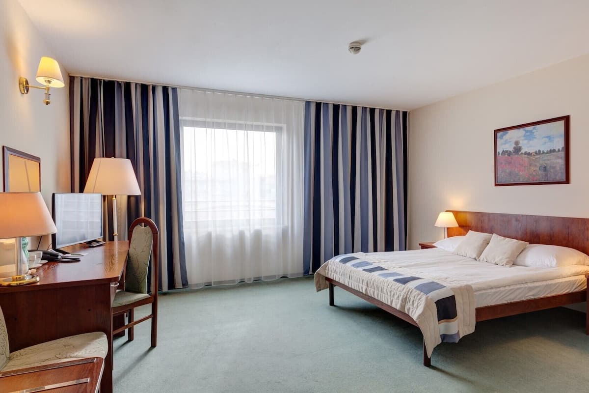 Premium bedding, pillow-top beds, desk, free WiFi