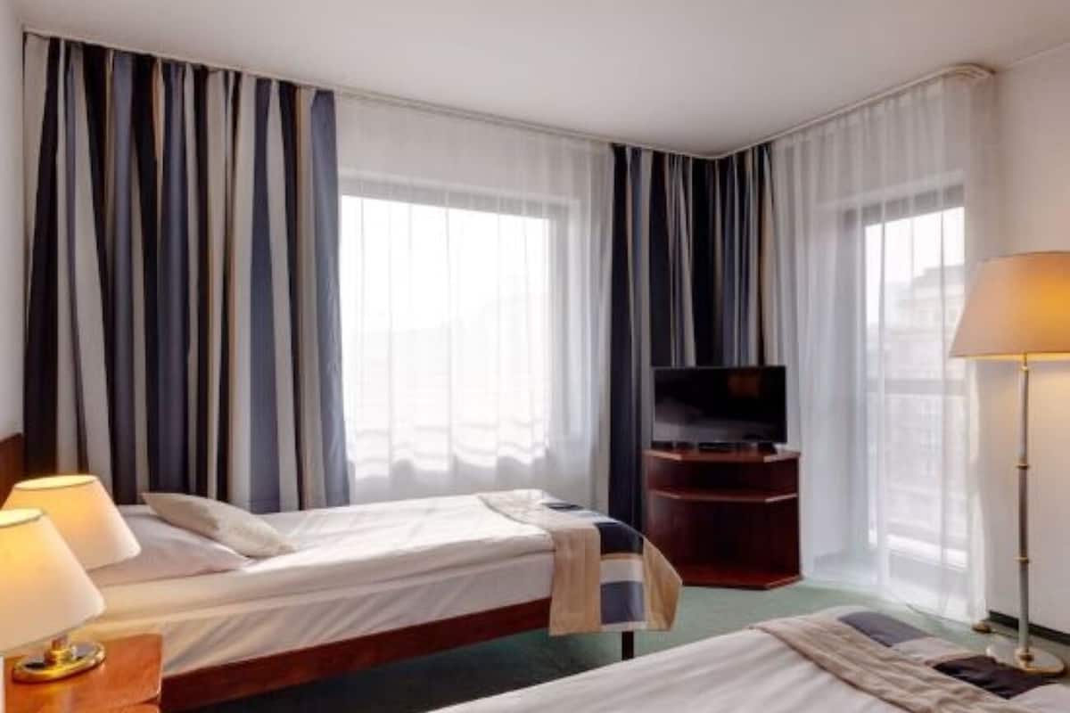 Premium bedding, pillow-top beds, desk, free WiFi