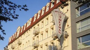 A hotel with a classic architectural style, featuring multiple balconies and a prominent sign. - Hotel Hetman (Warsaw)