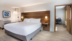 A modern hotel room with a large bed, bedside tables, a desk, and a chair. - Holiday Inn Express Wisconsin Dells by IHG (Baraboo)