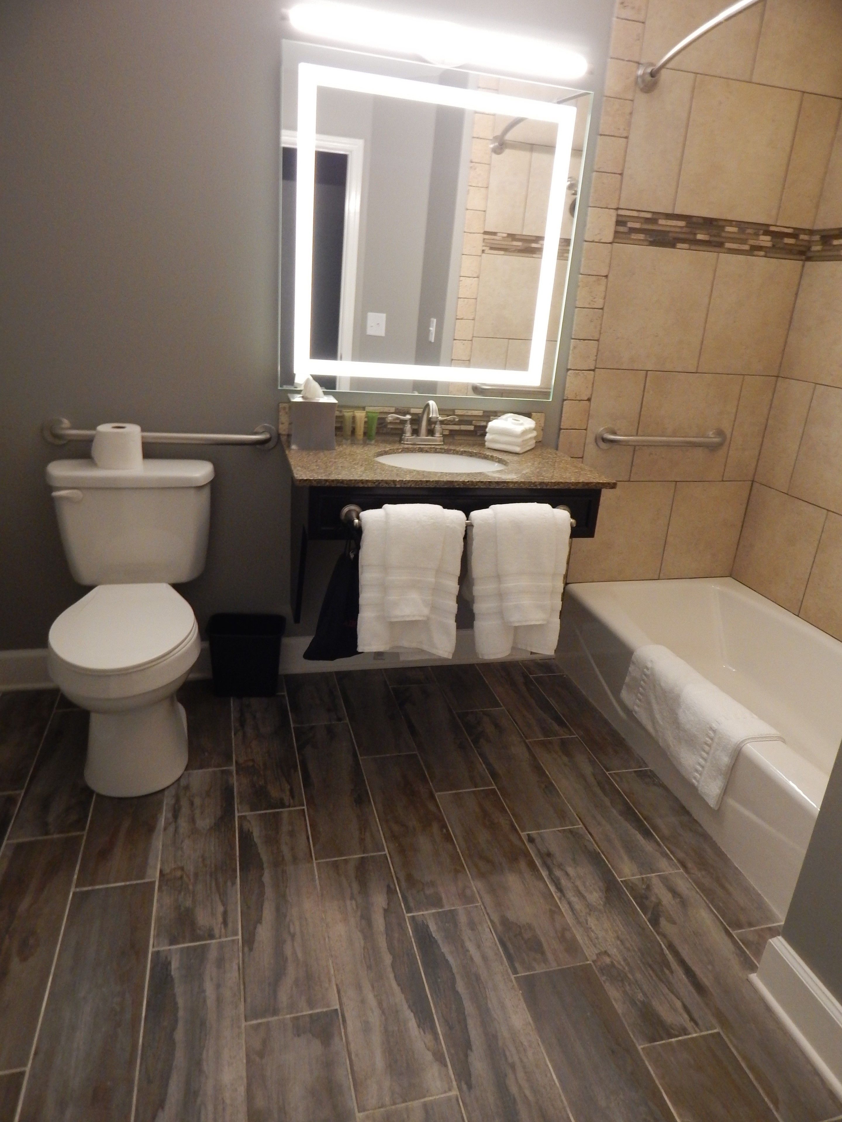 designer toiletries, hair dryer, towels