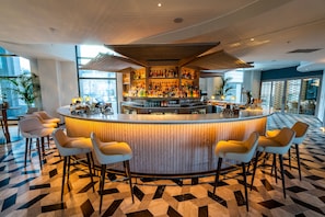 3 bars/lounges, rooftop bar, lobby lounge
