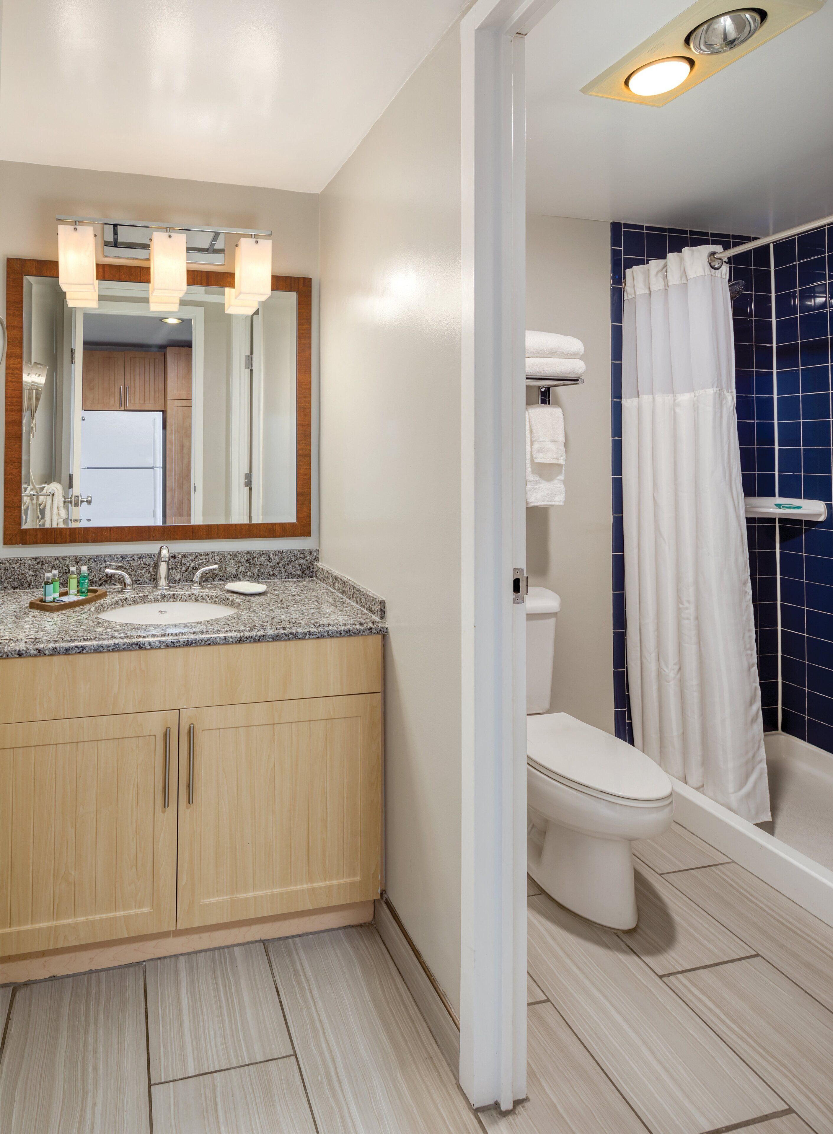 combined shower/bathtub, hair dryer, towels, soap