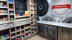 A snack display area with various packaged snacks and a chalkboard sign. - Hampton Inn & Suites Boise/Nampa at the Idaho Center (Nampa)
