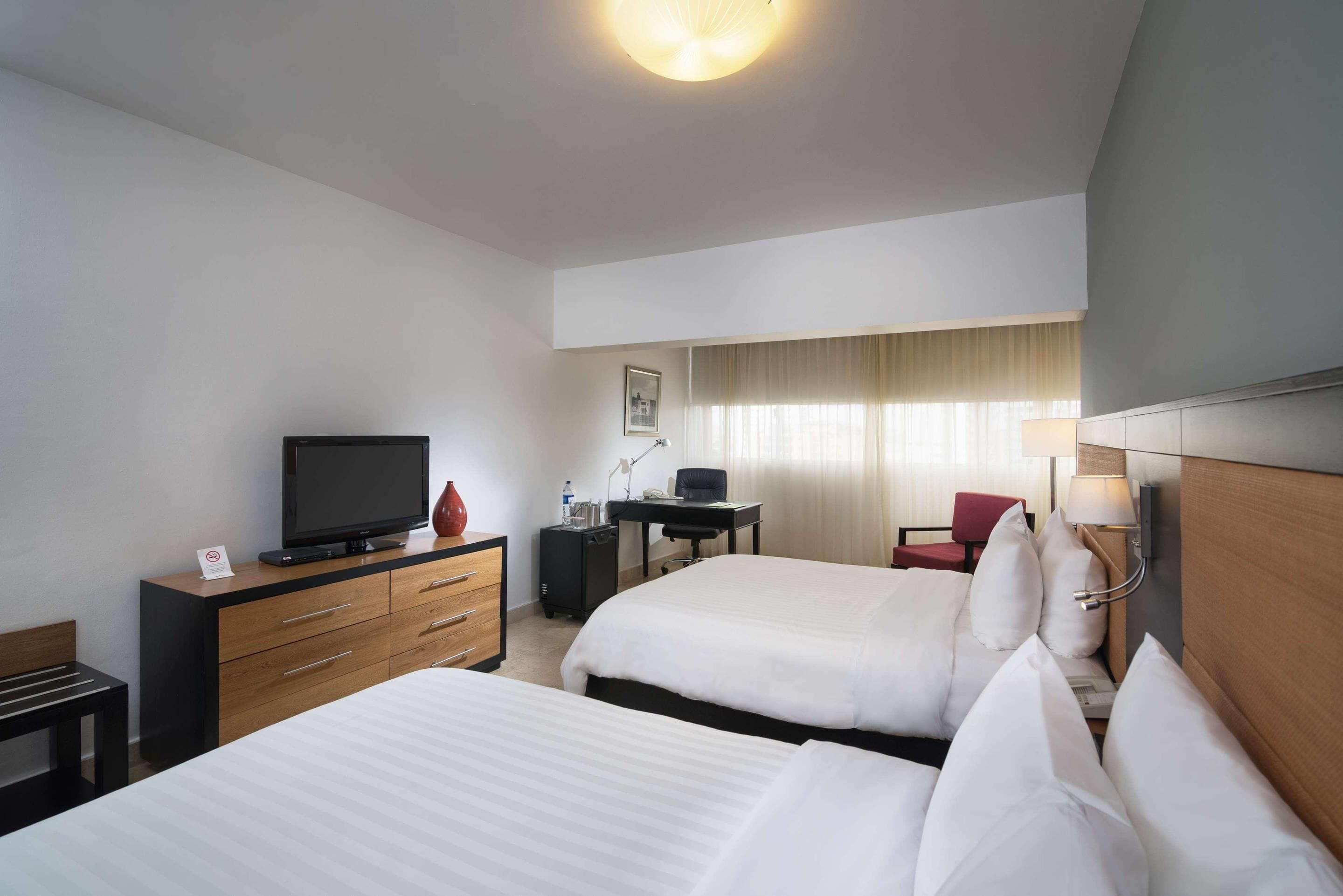 Hypo-allergenic bedding, down duvets, pillow-top beds, in-room safe