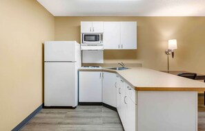 Full-sized fridge, microwave, stovetop, coffee/tea maker