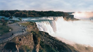 A large waterfall with a viewing platform and a paved walkway. - Holiday Inn Express Hotel & Suites Buffalo-Airport by IHG (Buffalo)