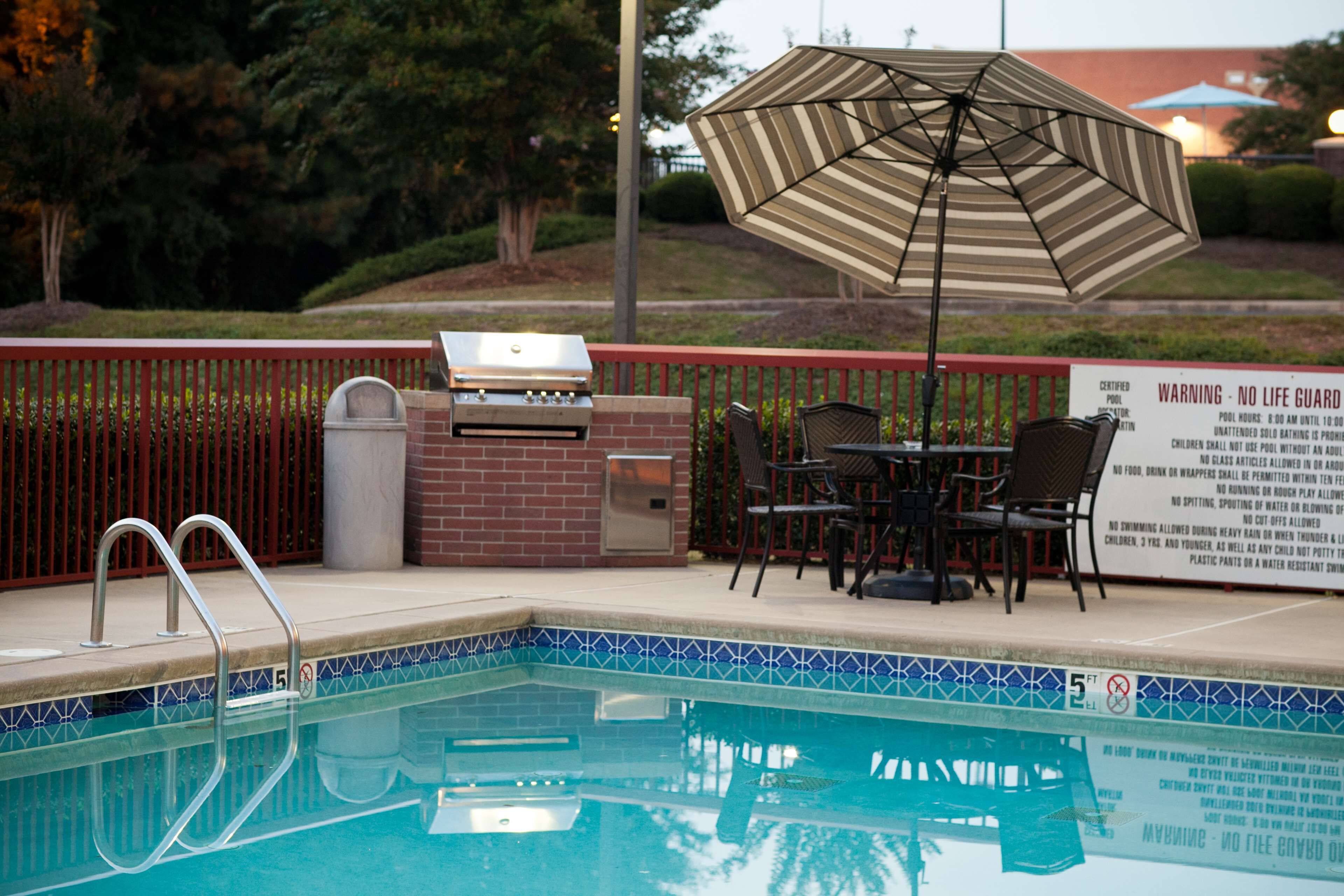 seasonal outdoor pool, open 10 am to 10 pm, pool loungers