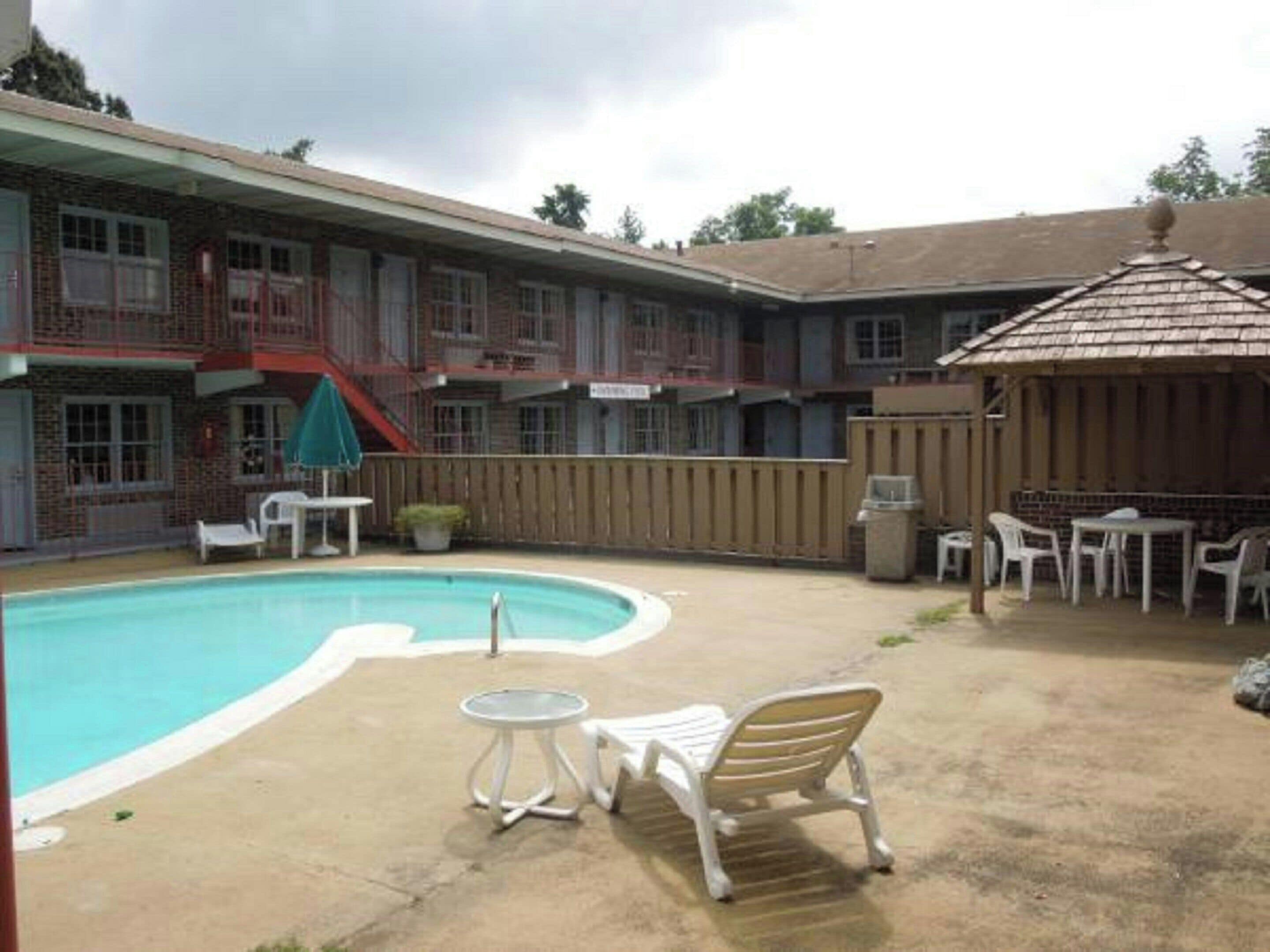 Seasonal outdoor pool, pool umbrellas, pool loungers