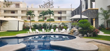 2 outdoor pools, open 8:00 AM to 8:00 PM, pool umbrellas, sun loungers