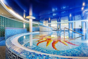 Indoor pool, pool loungers, lifeguards on site
