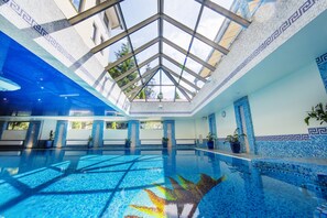 Indoor pool, pool loungers, lifeguards on site