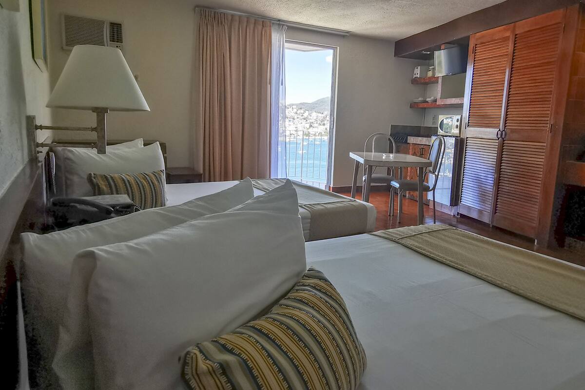 Suite superior, vistas al mar | Ropa de cama