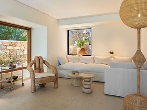 1-Bedroom Infinity Villa | Living area | 43-inch LED TV with satellite channels, table tennis, toys - Cape Sounio, A Grecotel Resort to Live (Lavreotiki)