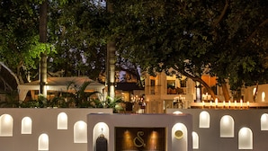A building with a sign that reads "SEVILLA" and a series of illuminated windows. - The Claridges, New Delhi (New Delhi)
