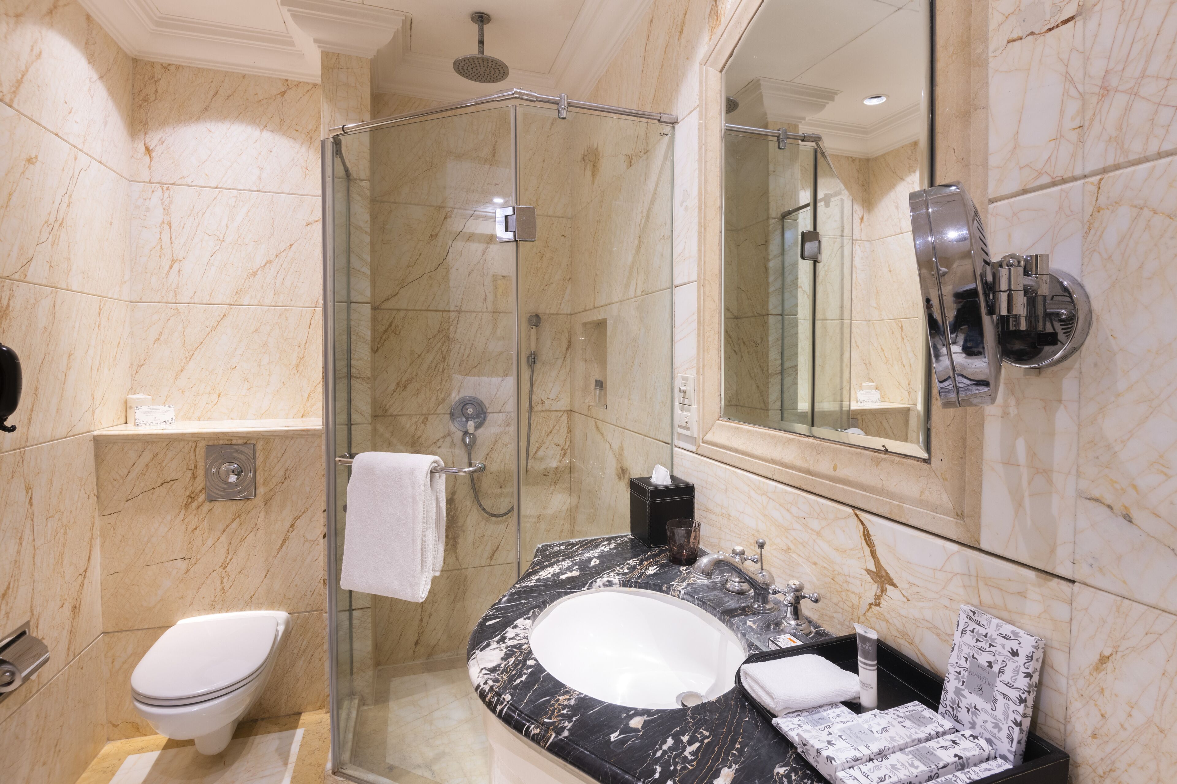 Designer toiletries, hair dryer, bathrobes, slippers