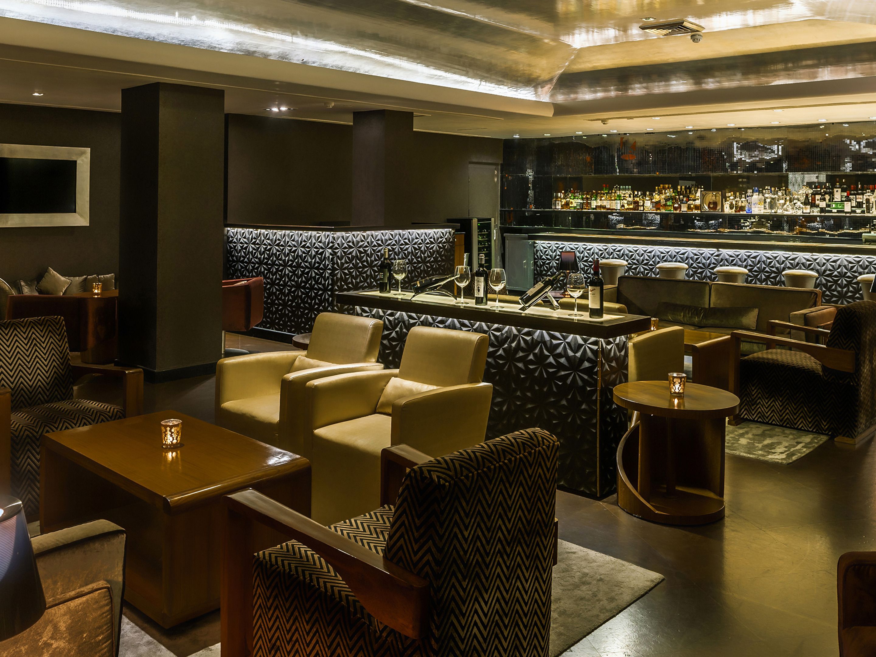 A bar area with seating and a bar counter.