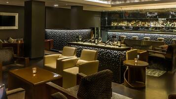 A bar area with seating and a bar counter.