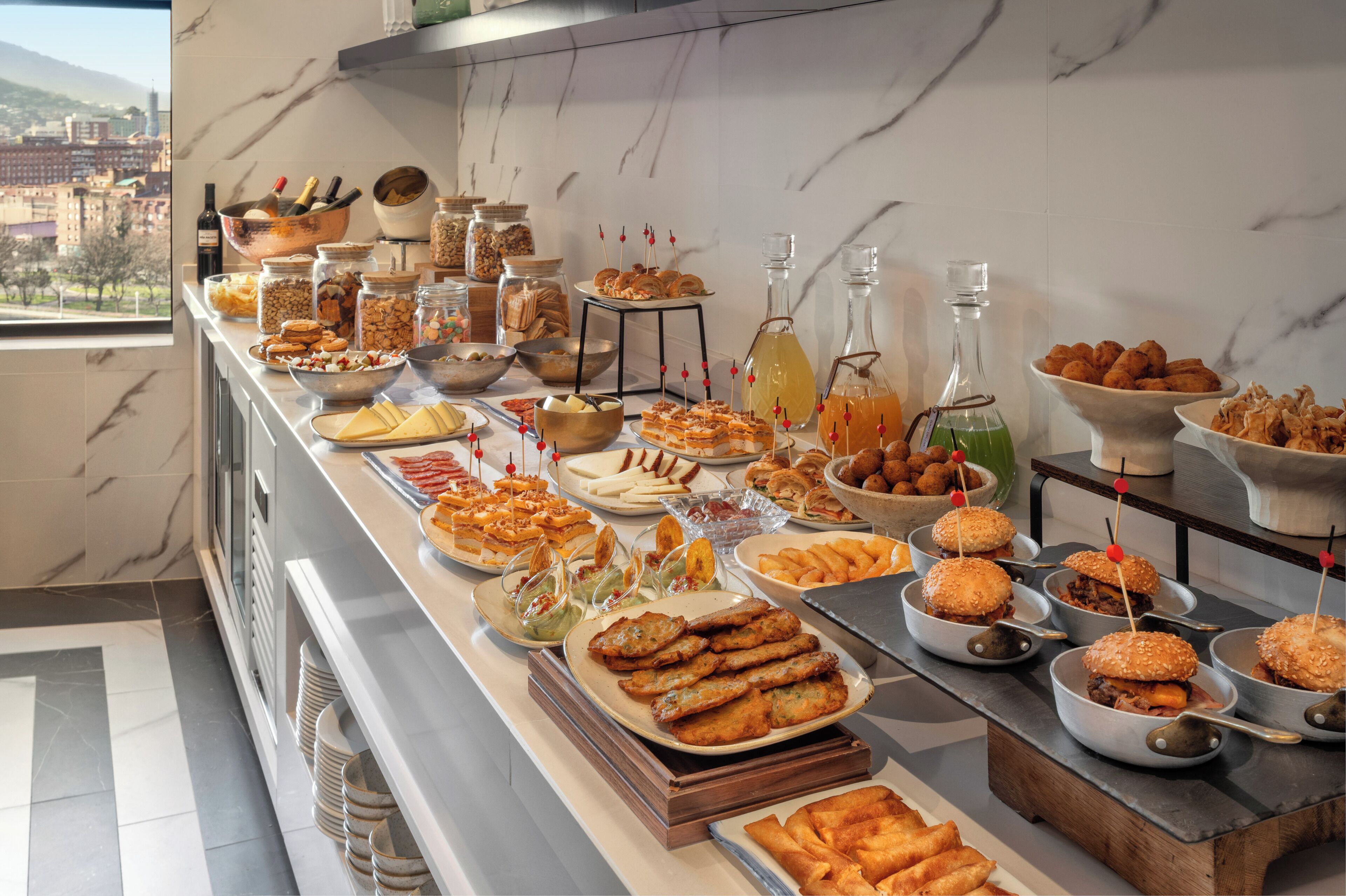 A buffet with various food items and condiments.