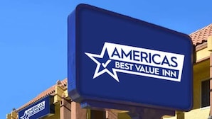 A sign for the Americas Best Value Inn with a clear blue sky in the background. - Americas Best Value Inn Holly Springs (Holly Springs)