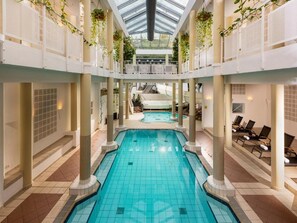 Indoor pool, outdoor pool, pool umbrellas, pool loungers