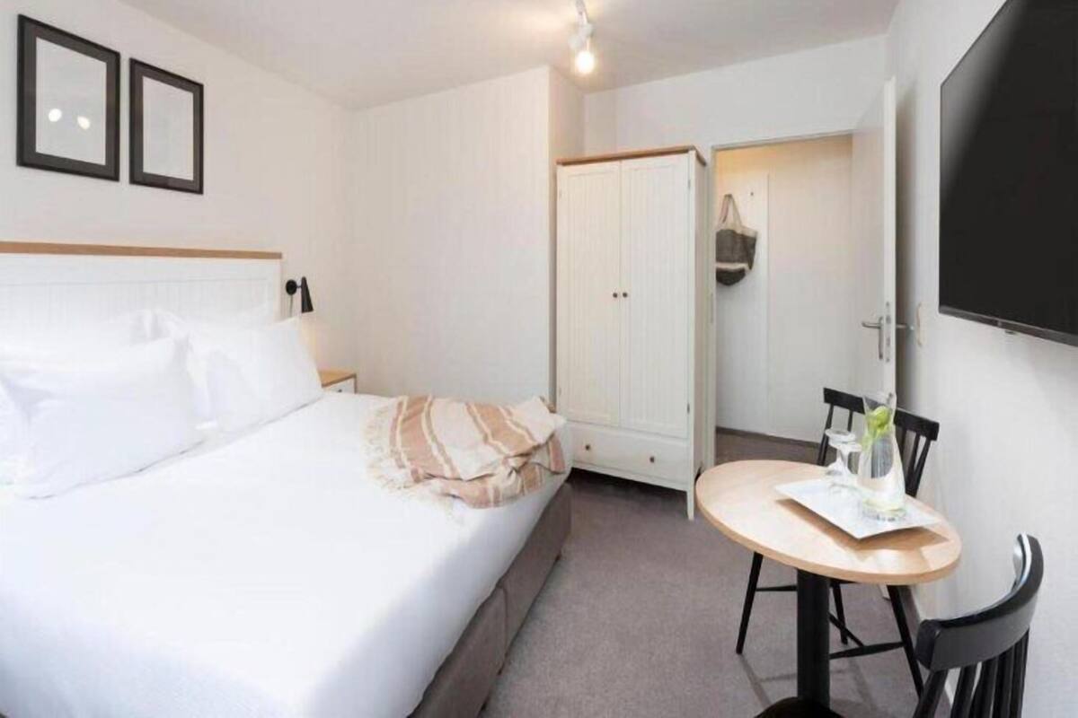 Premium bedding, desk, blackout curtains, bed sheets