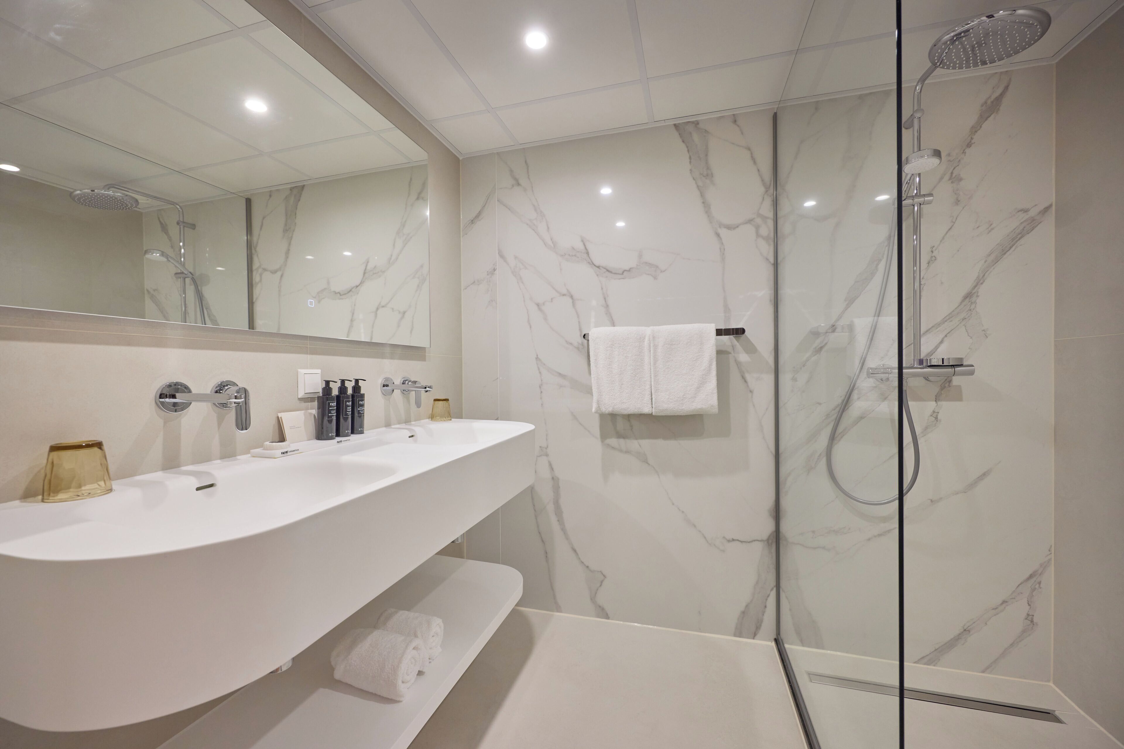 studio | bathroom | hair dryer, towels, soap, shampoo