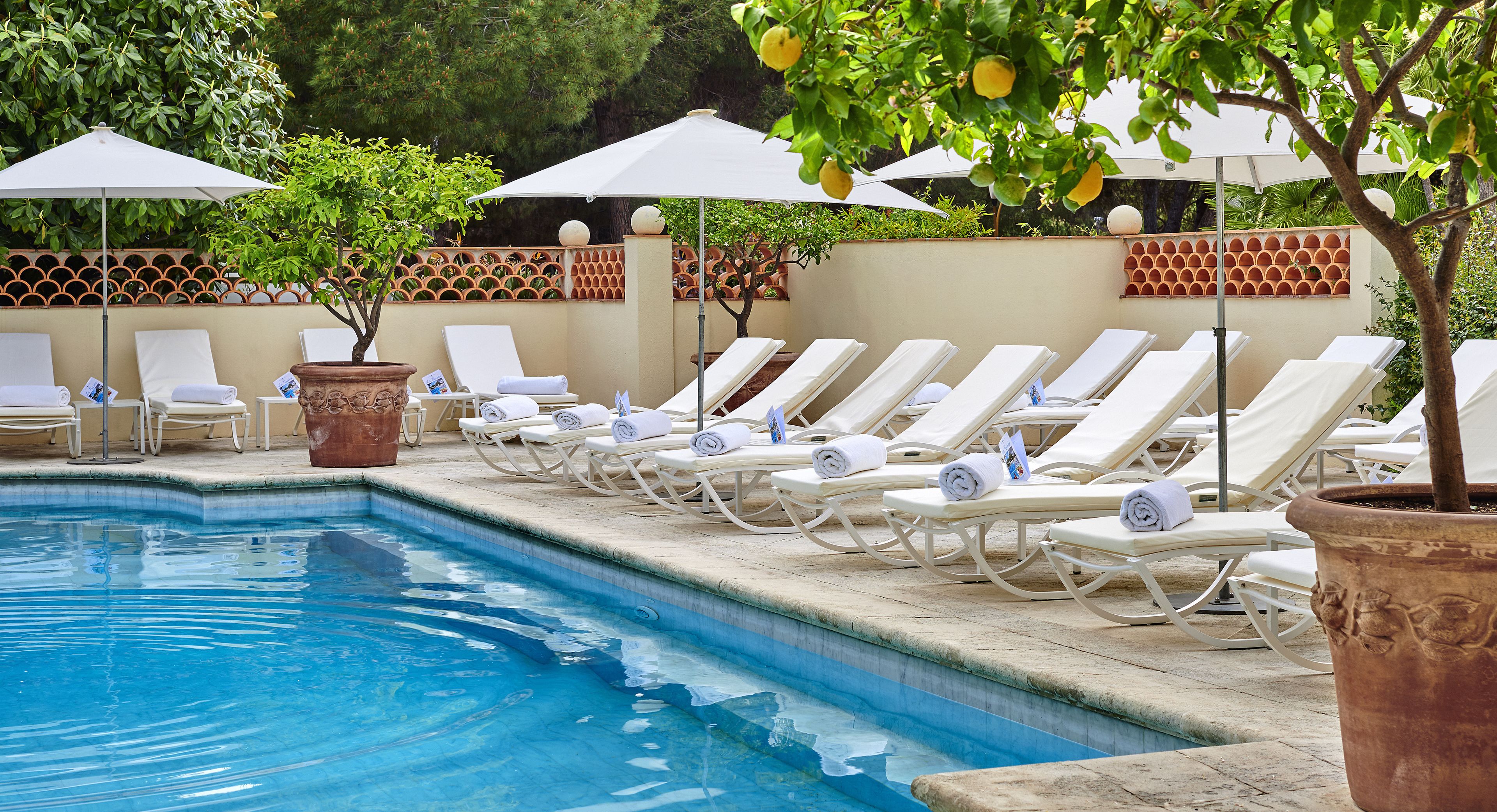 Seasonal outdoor pool, pool umbrellas, pool loungers