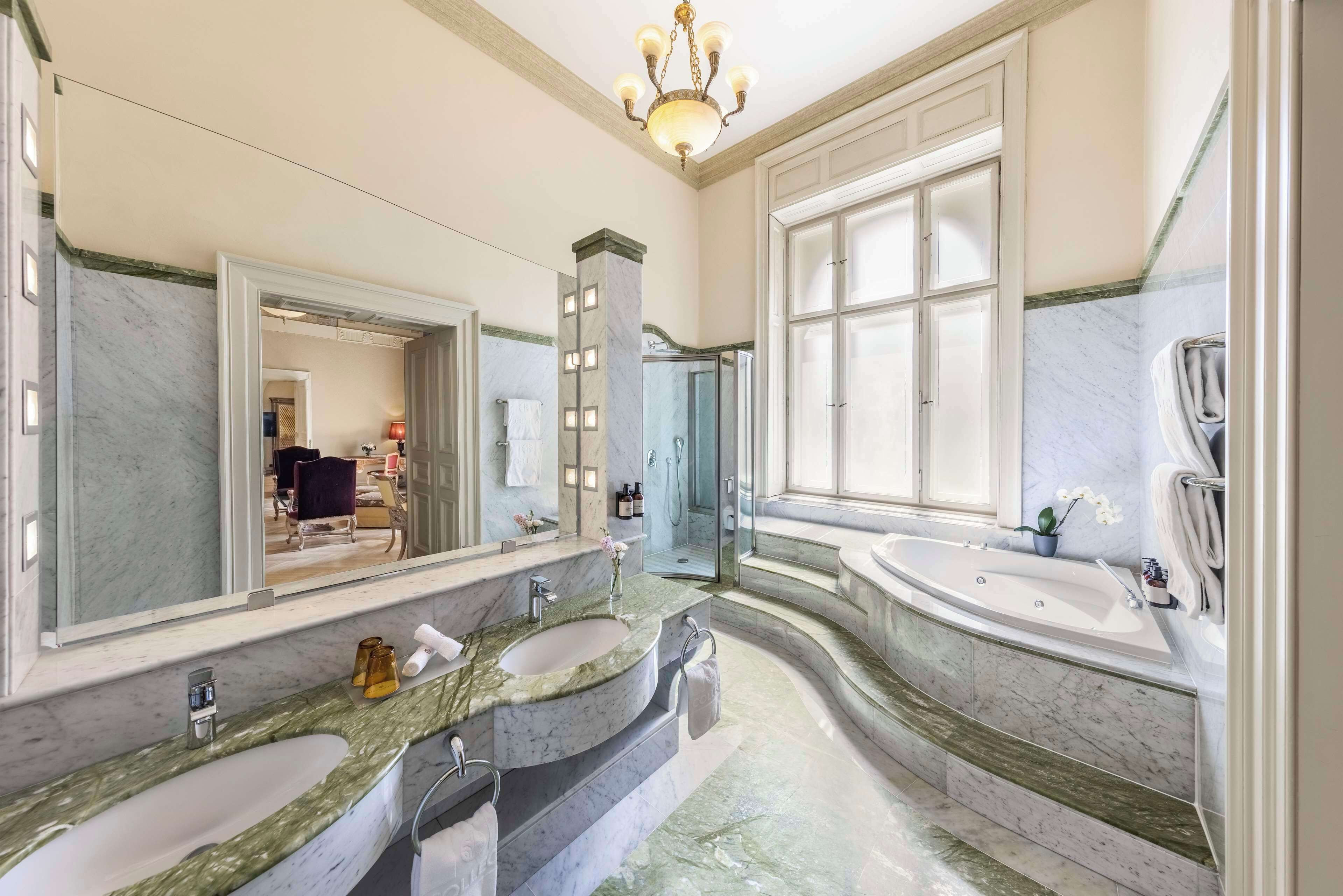 rainfall showerhead, designer toiletries, hair dryer, bathrobes