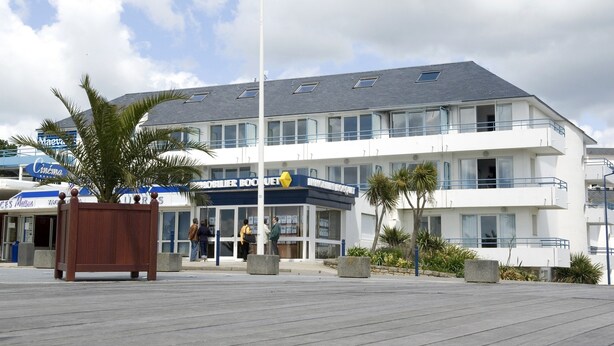 A building with a sign reading "Hotel du Bocage."