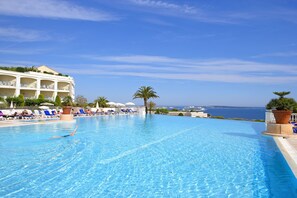 Seasonal outdoor pool, pool umbrellas, pool loungers