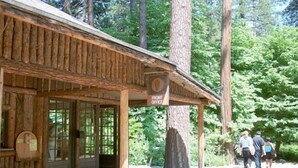 A rustic wooden cabin with a sign reading "Fire Office". - Curry Village (Yosemite National Park)