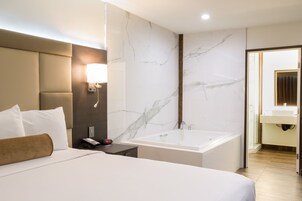 Romantic Suite, 1 King Bed, Jetted Tub | Living area