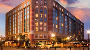 A Marriott hotel with multiple floors, large windows, and a prominent entrance with outdoor seating. - Houston Marriott Sugar Land (Sugar Land)