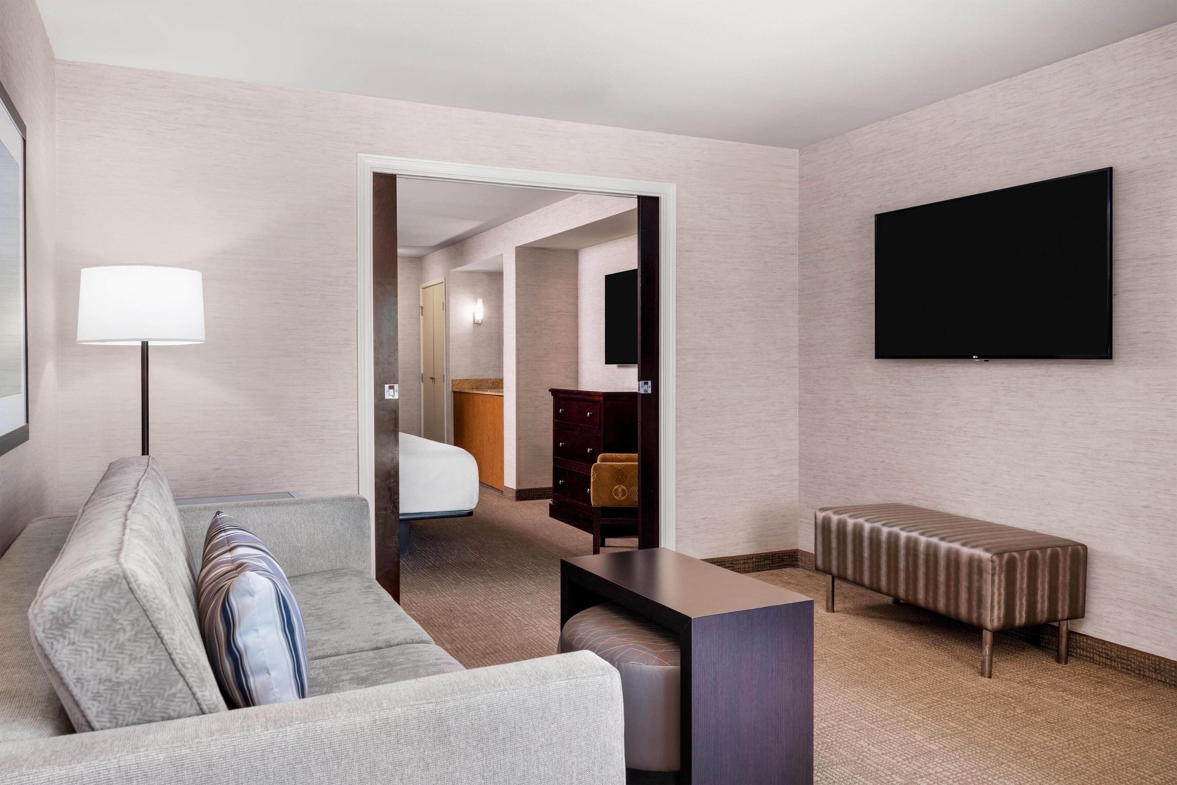 Premium bedding, desk, laptop workspace, soundproofing
