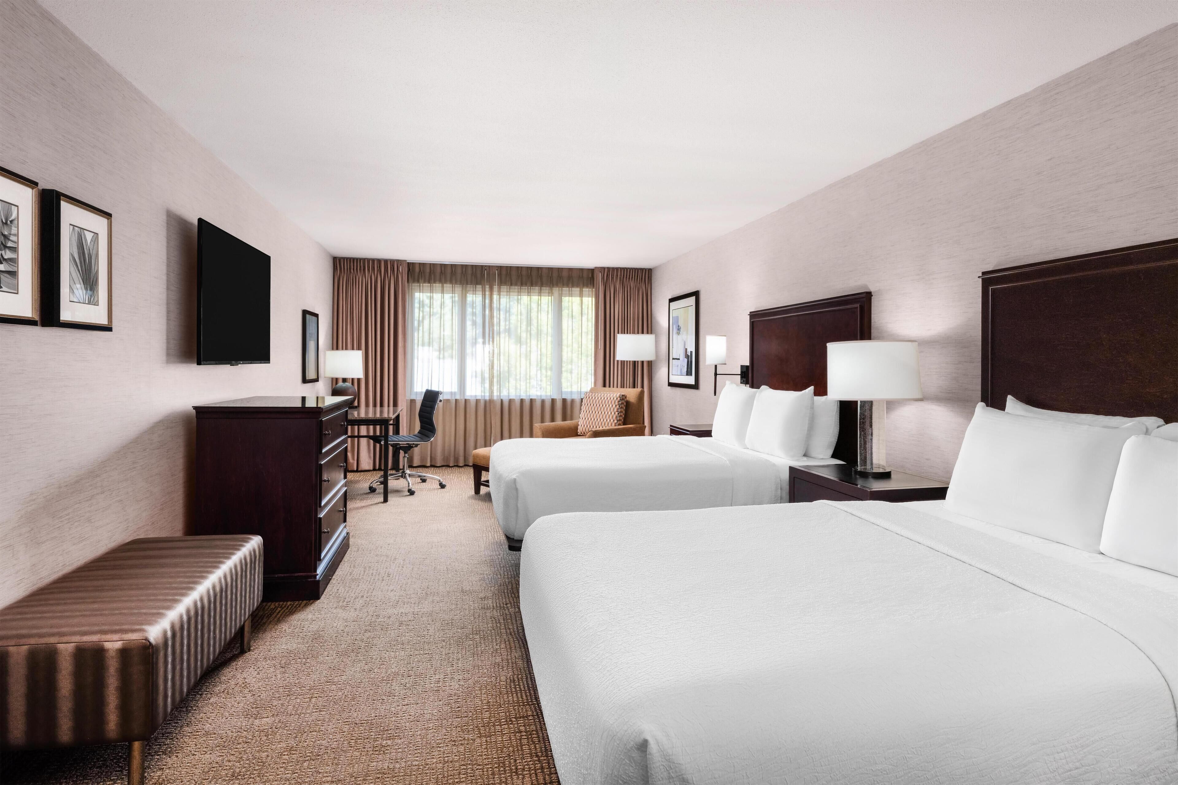 Premium bedding, desk, laptop workspace, soundproofing