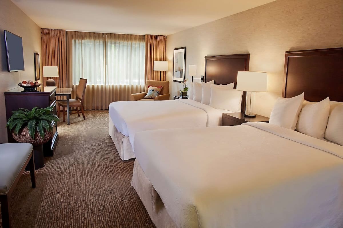 Premium bedding, desk, laptop workspace, soundproofing