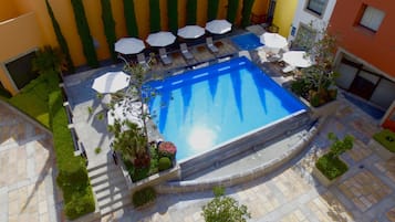 Outdoor pool, pool umbrellas, pool loungers