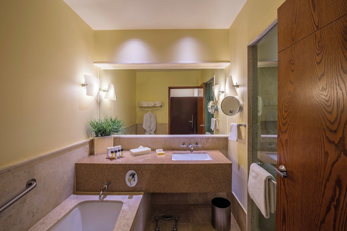 separate bathtub and shower, deep-soaking bathtub, rainfall showerhead