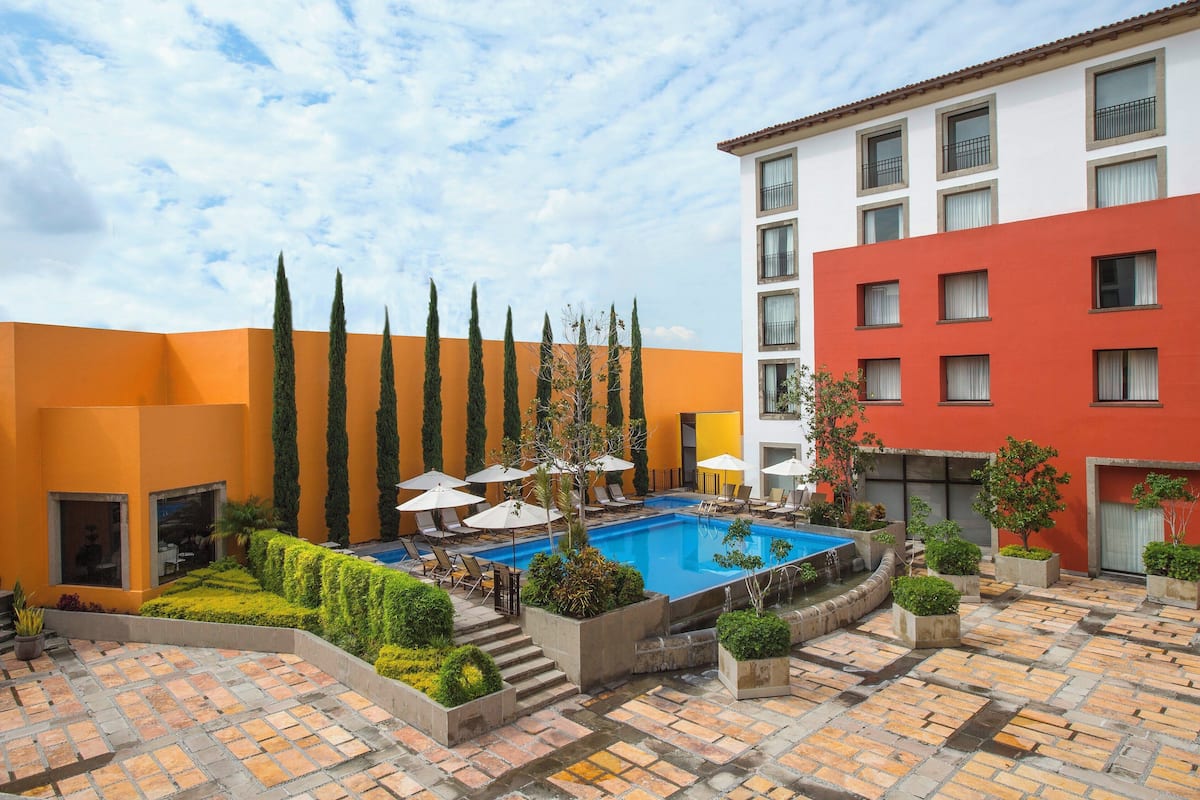 outdoor pool, pool umbrellas, pool loungers