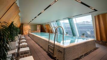 Indoor pool, open 7:00 AM to 10:00 PM, pool loungers