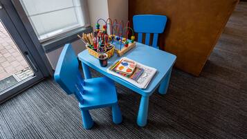 Work in comfort with a dedicated workspace featuring a table, chairs, and a bench.