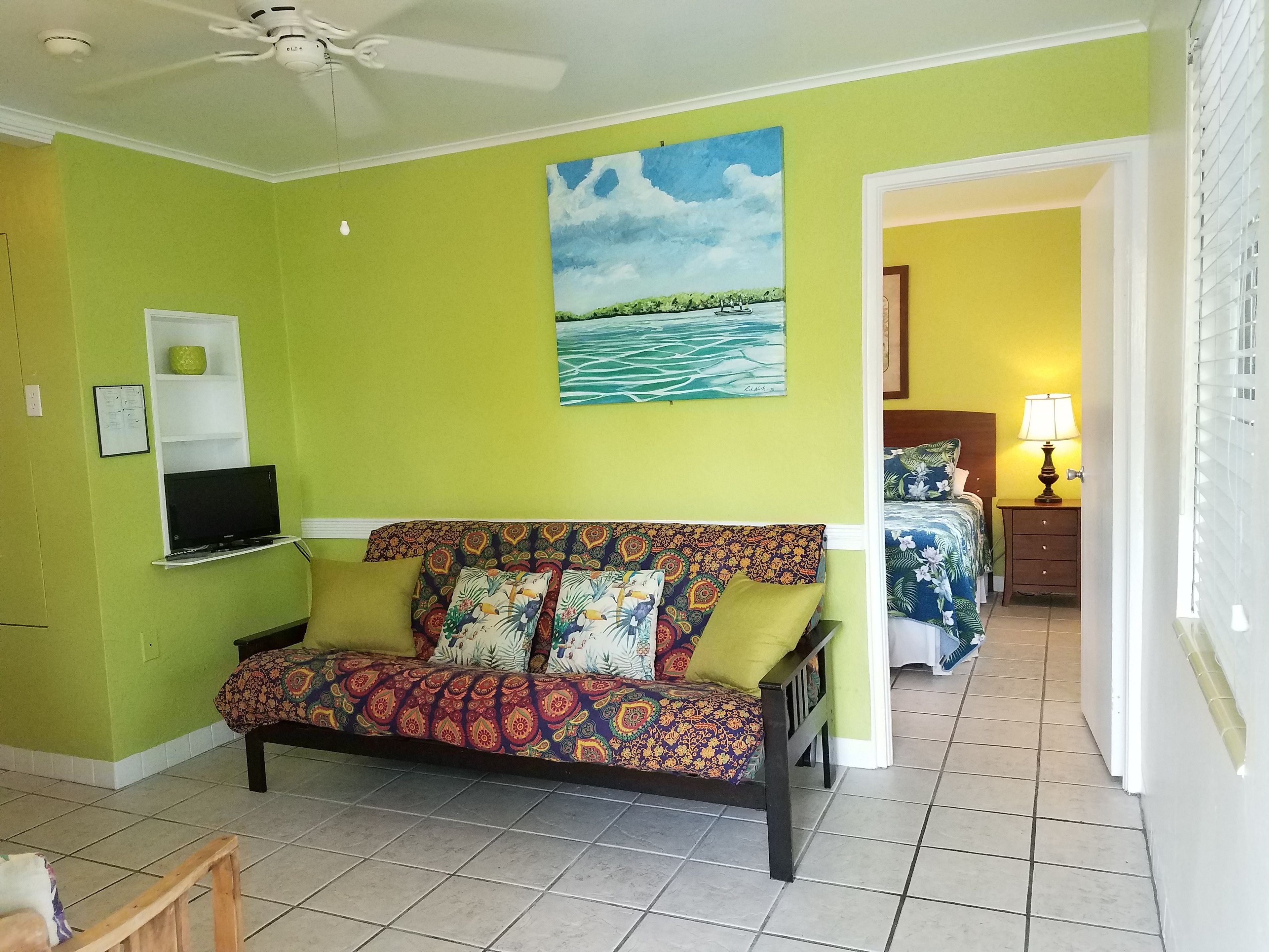 queen suite #6, full kitchen, ground floor, pool view, private bathroom | living room | flat-screen tv