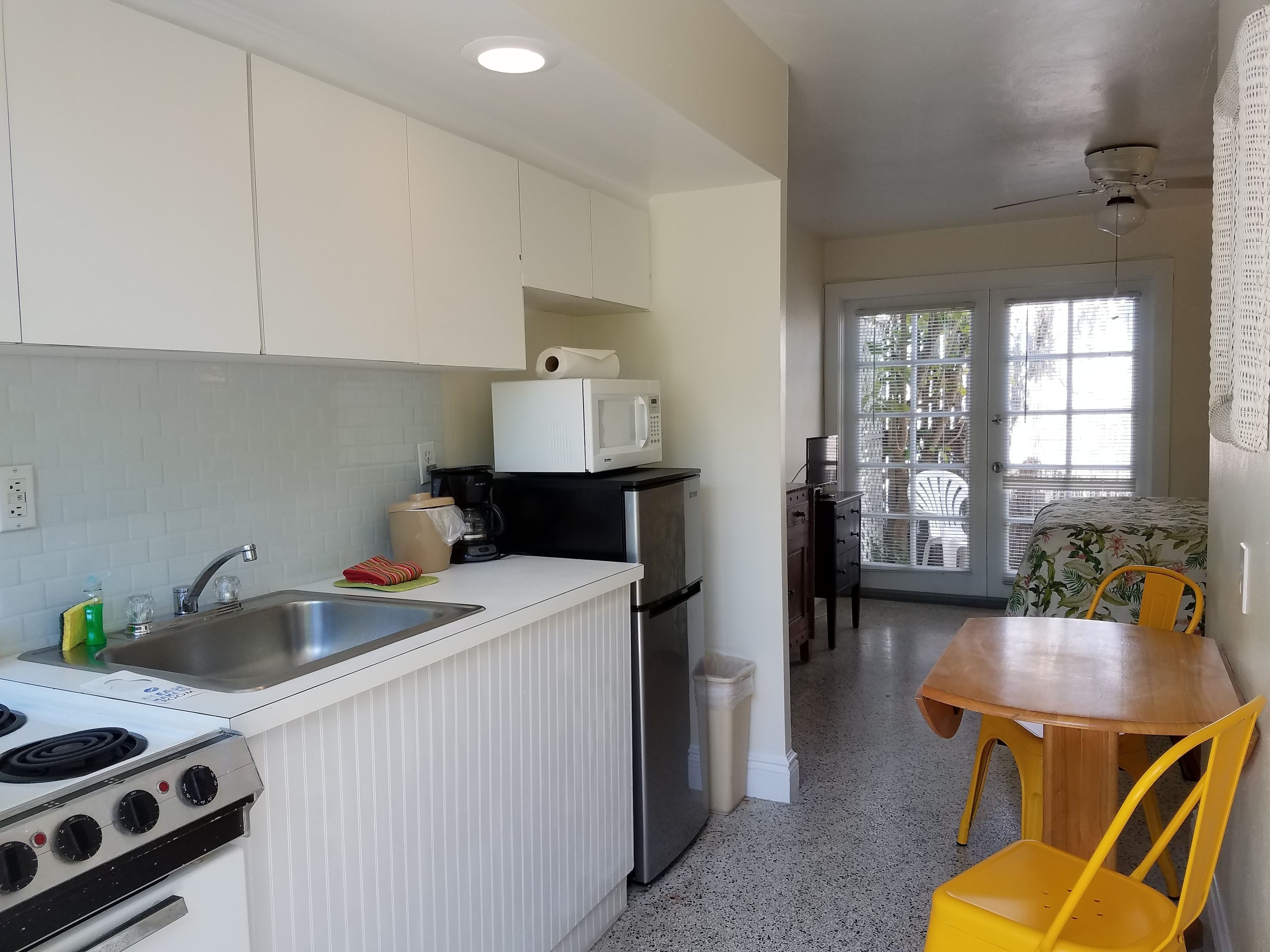 queen studio #4, full kitchen, ground floor, pool view, private bathroom | room amenity