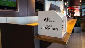 A fast check-out area with a sign that reads "All Accor Live Limitless". - ibis Hotel Köln Messe (Cologne)