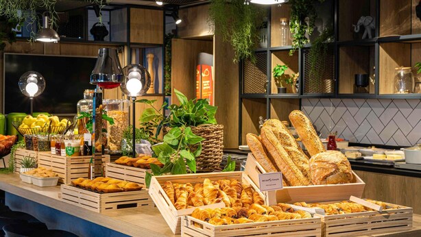 A breakfast buffet with various pastries, bread, and beverages. - ibis Hotel Köln Messe (Cologne)