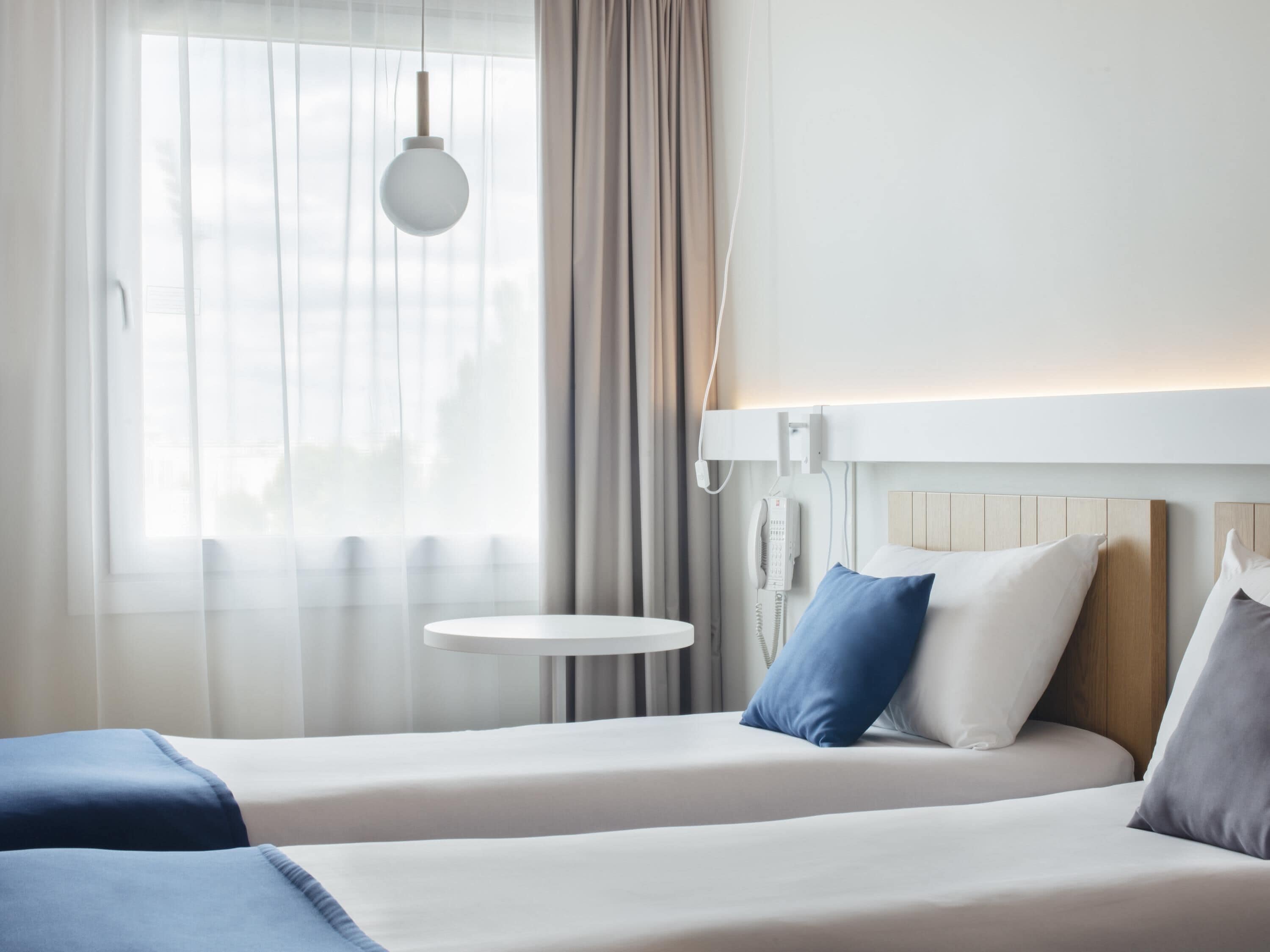 Chambre Premium, 2 lits une place | Bureau, fer et planche à repasser, Wi-Fi gratuit, draps fournis