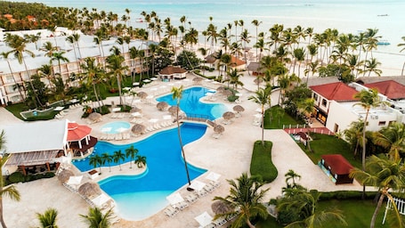 On the beach, white sand, sun loungers, beach towels. Sunscape Coco Punta Cana - All Inclusive