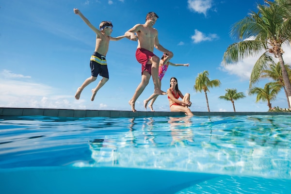 6 outdoor pools, open 9:00 AM to 7:00 PM, pool umbrellas, sun loungers