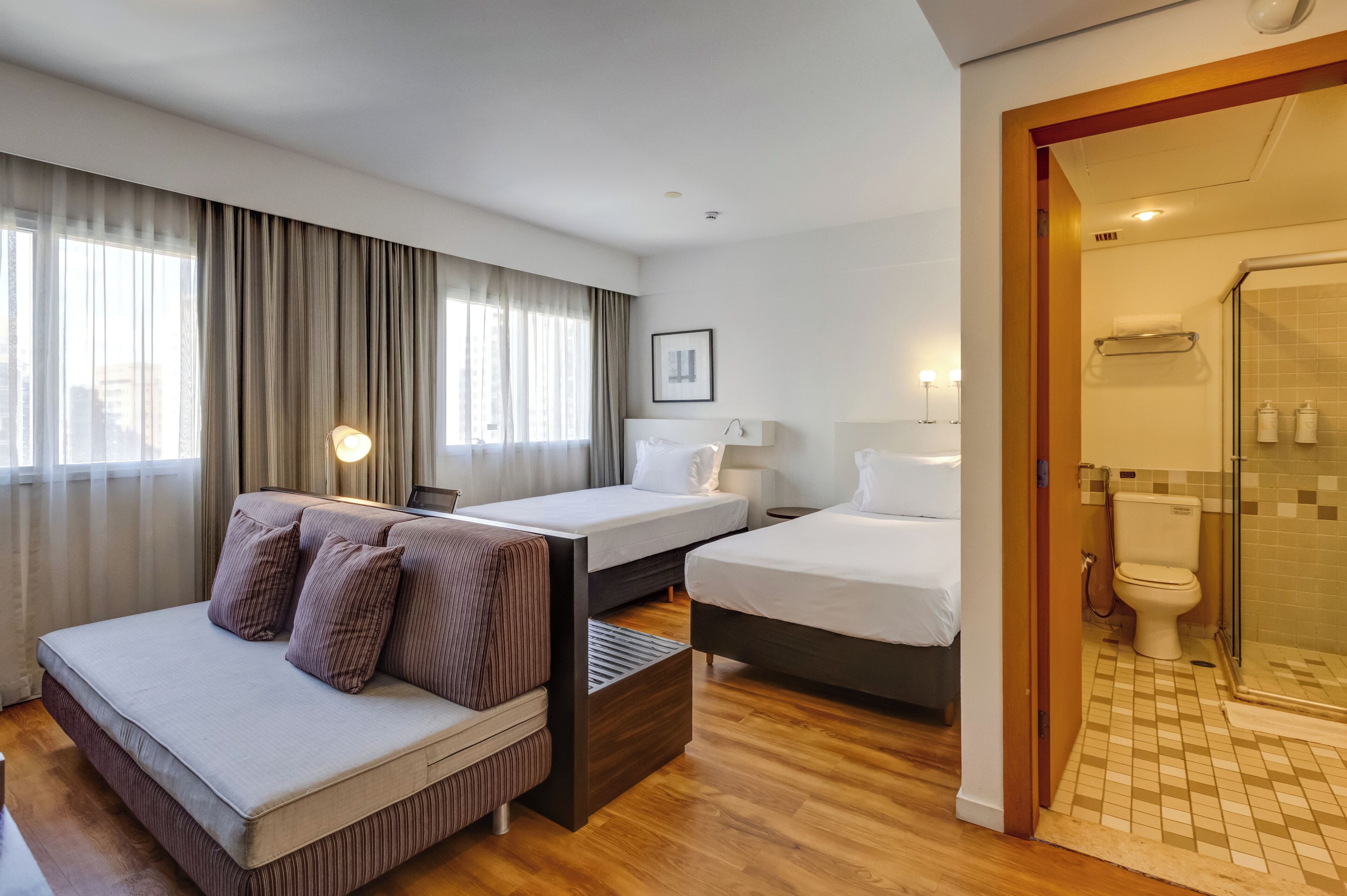 deluxe twin room | minibar, in-room safe, desk, blackout curtains